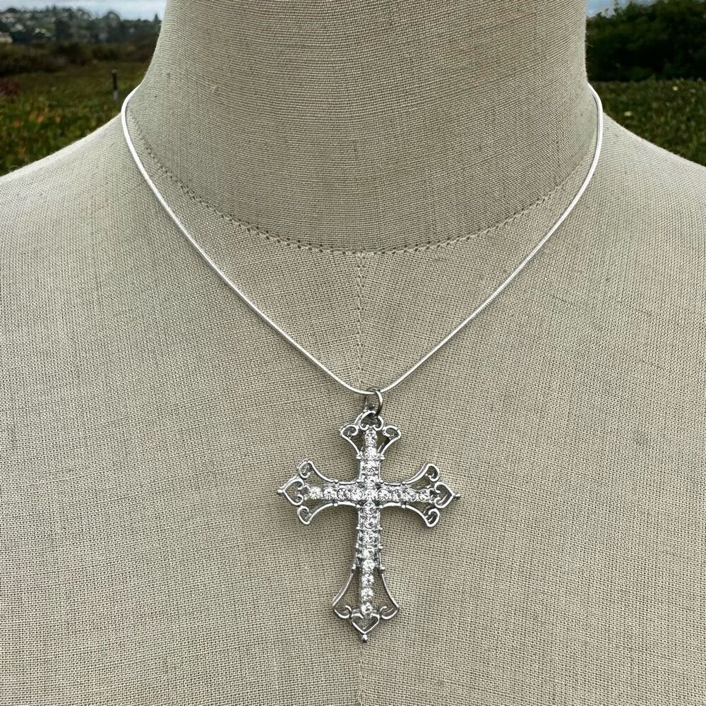 Silver tone rhinestone cross necklace